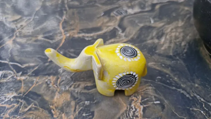 Yellow soap stone elephant. As good as new. Preloved.