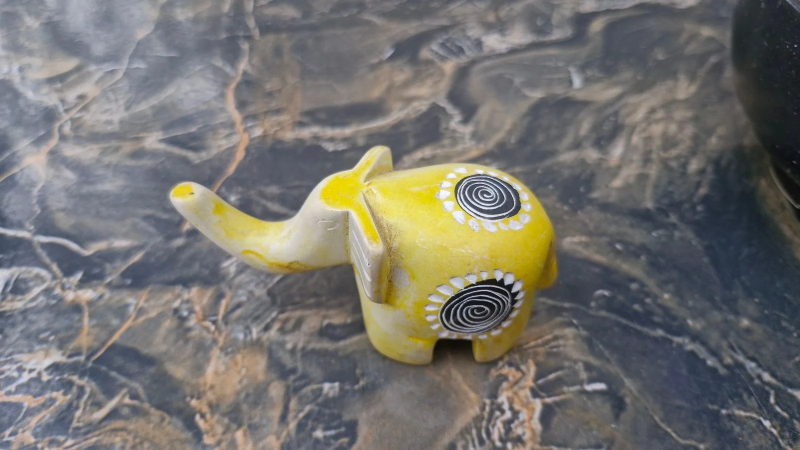 Yellow soap stone elephant. As good as new. Preloved.