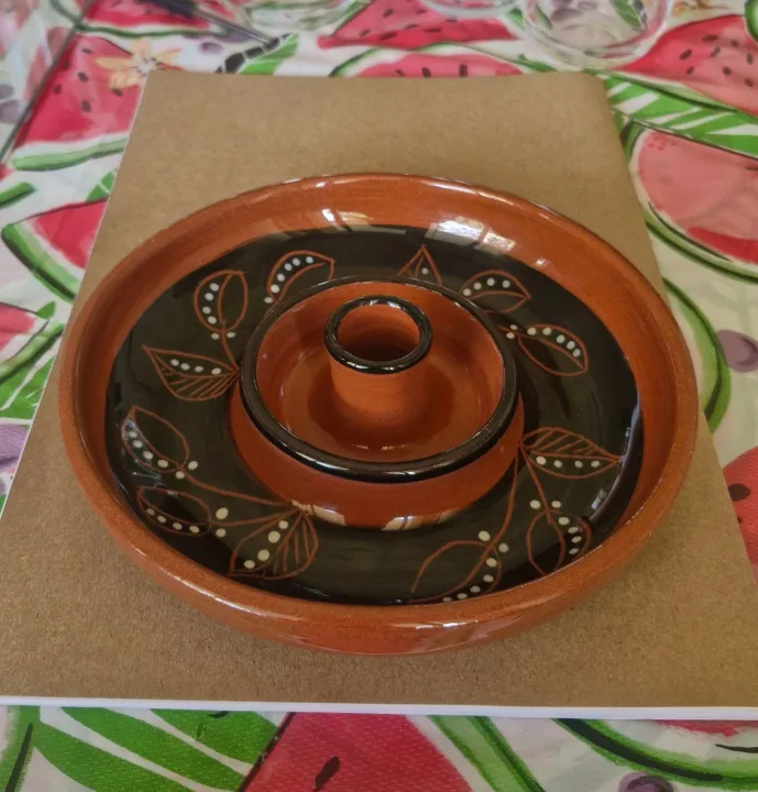 Glazed pottery candle holder.