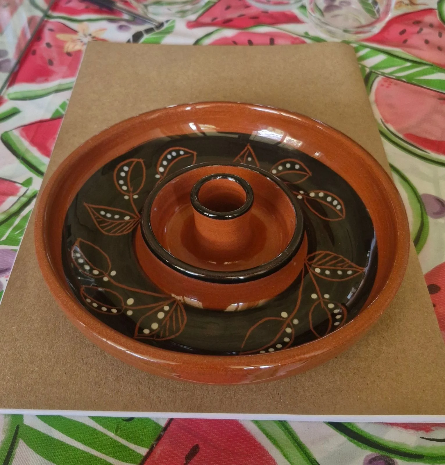 Glazed pottery candle holder.
